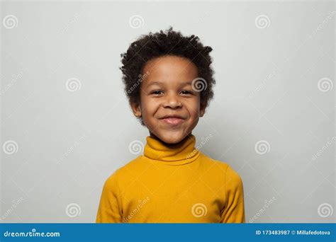 Portrait Of Happy Little Black Kid Boy Smiling On White Background