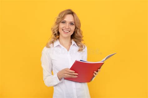 Happy Blonde Businesswoman Woman In White Shirt Making Notes In Notepad