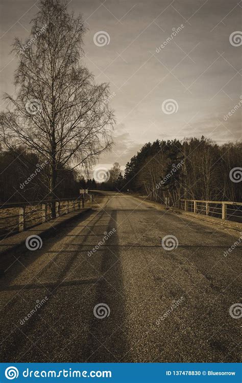 Country Gravel Road With Old And Broken Asphalt Vintage Retro Look