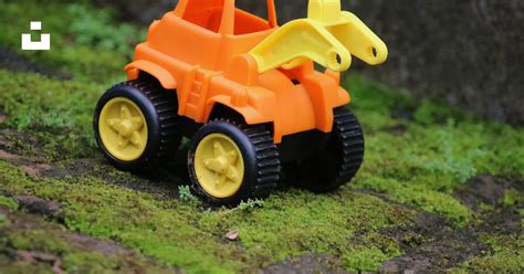 Yellow and orange truck toy photo – Free Toy Image on Unsplash