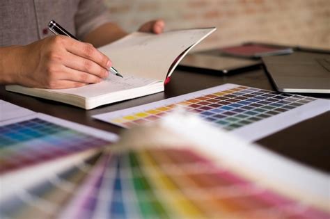 Premium Photo Midsection Of Man Writing In Book On Table