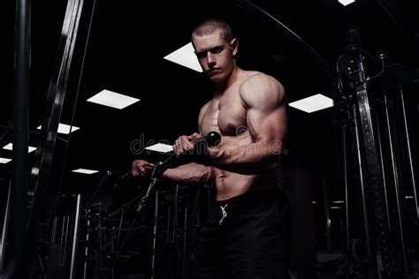 Brutal Strong Athletic Man Pumping Up Muscles Muscular Bodybuilder With Naked Sport Torso Doing