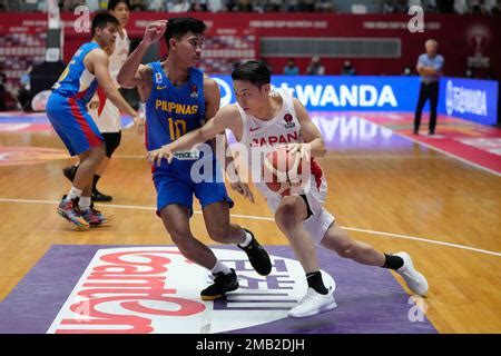 Japan S Yuki Kawamura Right Drives Past Iran S Hamed Ehaddadi During