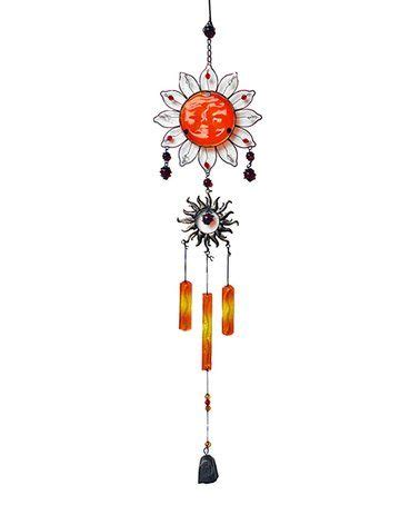 An Orange Sunflower Wind Chime Hanging From A Chain With Beads And