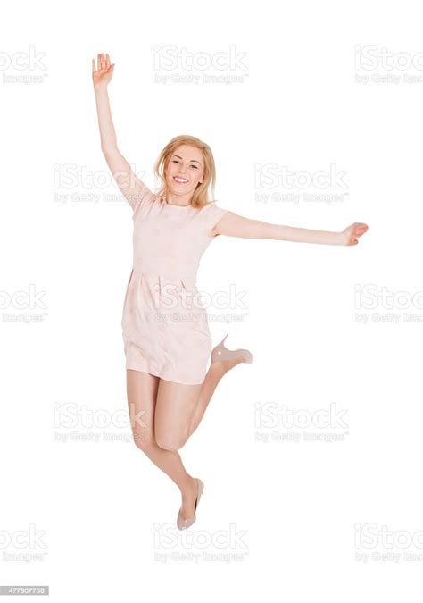 Excited Woman Jumping Against White Background Stock Photo Download