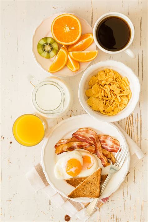 American Breakfast With Sunny Side Up Eggs Bacon Toast Pancakes