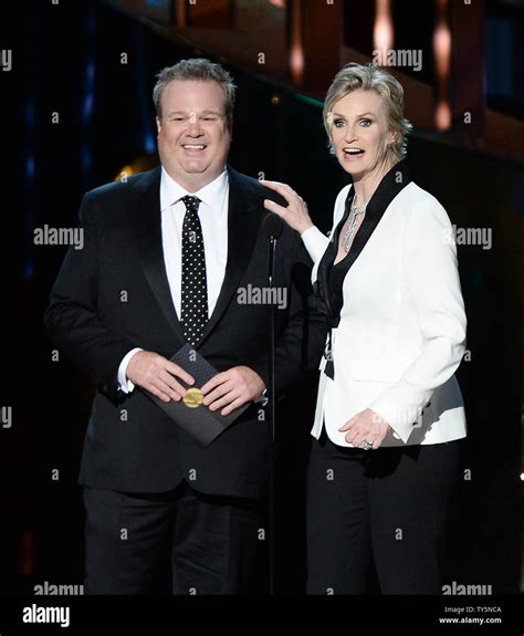 Actor Eric Stonestreet L And Actress Jane Lynch Appear Onstage During