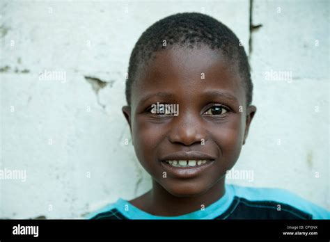 A closeup portrait of a male African child, smiling at camera Stock ...