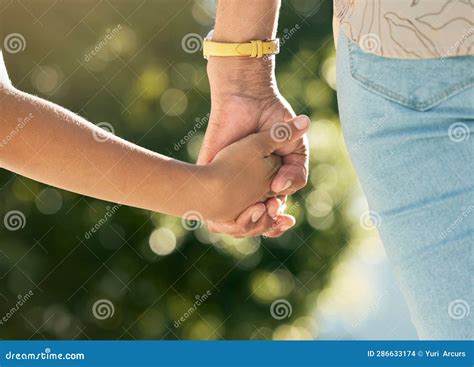 Holding Hands Mother And Daughter In Closeup Outdoor And Walking