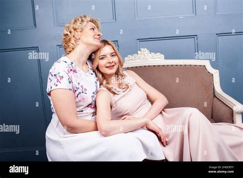 Lifestyle People Concept Mature Blond Mother With Teenage Daughter At Home Together Stock Photo
