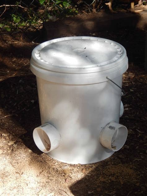 Diy Bucket Chicken Feeder From A 5 Gallon Bucket Chicken Feeders Pvc Chicken Feeder