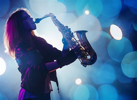 2,100+ Woman Saxophone Players Stock Photos, Pictures & Royalty-Free ...