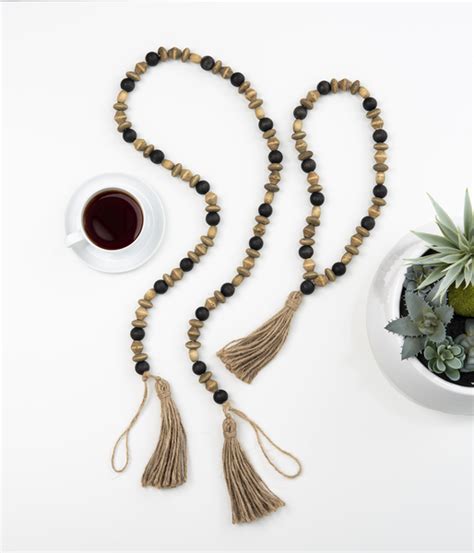 Wholesale Multi Size Natural And Black Wood Beaded Garland With Tassel Ganz