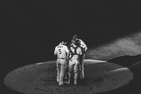 High Angle Shot of a Group of Baseball Players Talking · Free Stock Photo