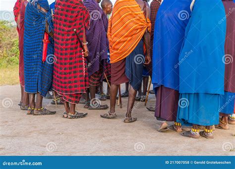 Group Of Massai People Participating A Traditional Dance With High