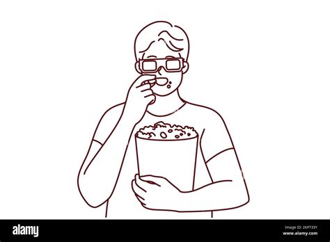 Happy Young Man In 3d Glasses Eating Popcorn Watching Movie In Cinema