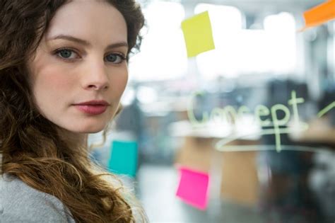 Premium Photo Confident Female Executive Standing In Creative Office