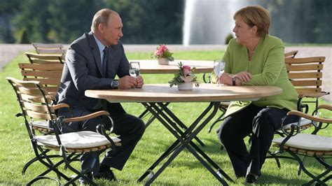 Angela Merkel, Vladimir Putin tackle tough topics in meeting outside Berlin