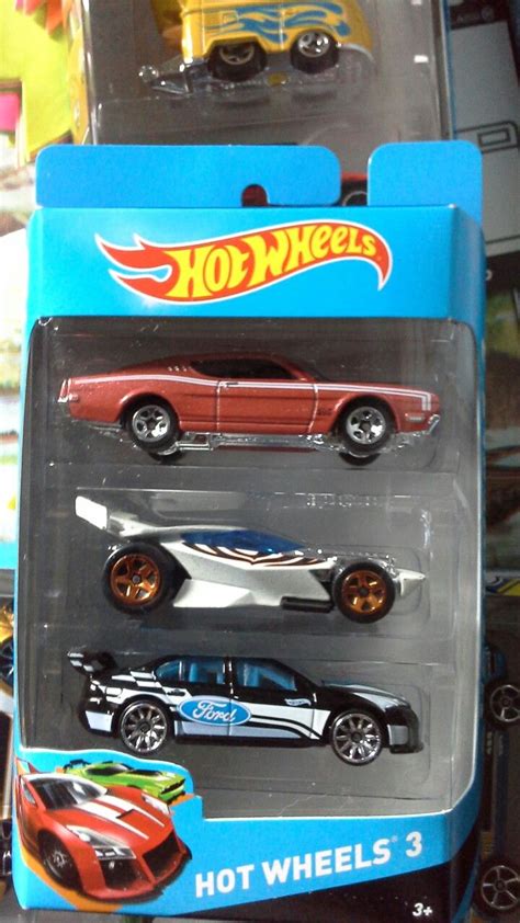 Three Hot Wheels Cars Are In The Package