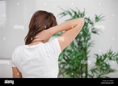 Brunette Massaging Her Painful Neck Stock Photo Alamy
