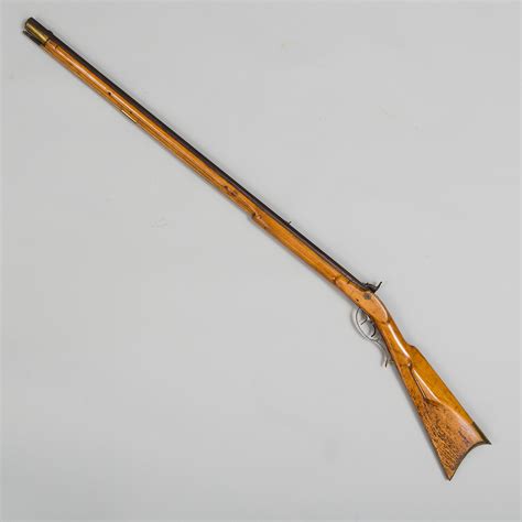 An early American 19th century percussion rifle ("Kentucky Longrifle