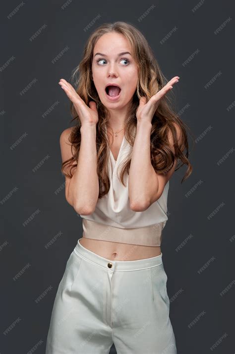 Premium Photo | Excited blonde woman screaming amazing shocking news