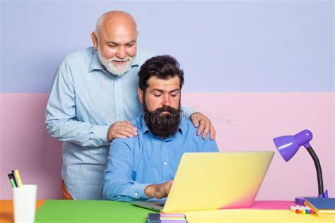 Old Manager Having Friendly Conversation At Meeting With Laptop Old