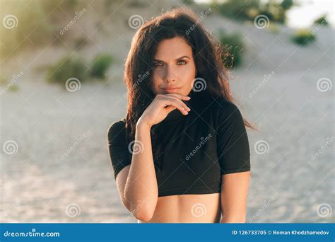 Portrait Of An Attractive European Woman Has Tanned Skin With Freckles