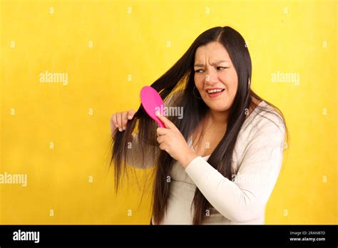 Adult Year Old Latina Woman Brushes Her Hair With Difficulty Because It Is Very Tangled Due