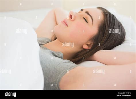 Brunette Sleeping In Her Bed Stock Photo Alamy