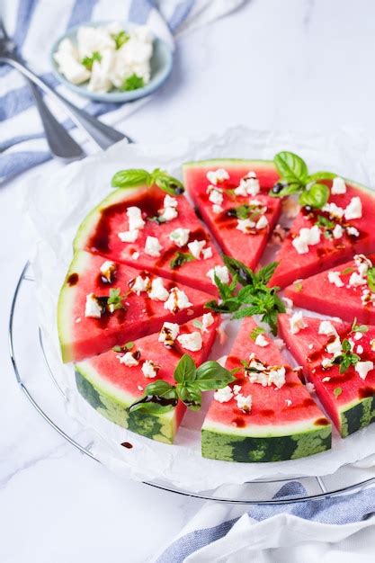 Premium Photo Watermelon Pizza With Feta Cheese And Herbs On A Table