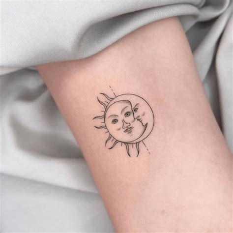 Fine Line Sun And Moon Tattoo On The Bicep