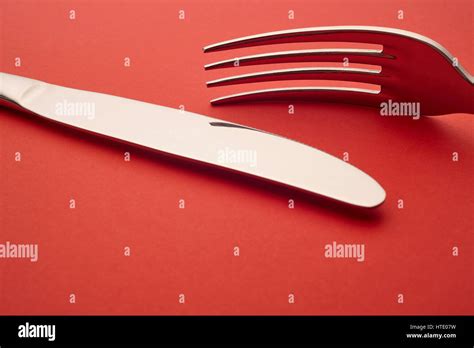 Knife And Fork Detail Over A Red Background Cutlery Horizontal Stock