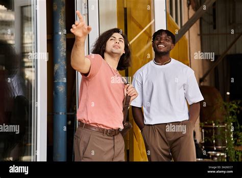 A Loving Gay Couple Shares Laughter And Connection While Exploring Their Favorite Cafe Together