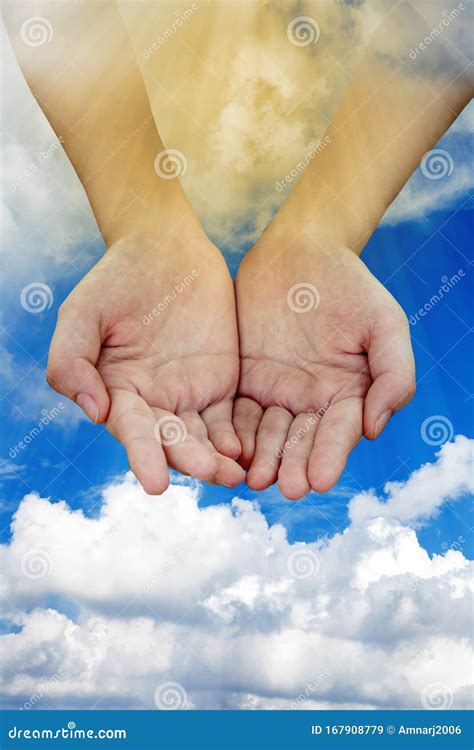 Two Hands Coming From A Cloudy Sky With Light Beam Concept Help Stock