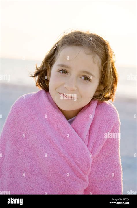 Girl Wrapped In Towel On Beach Portrait Stock Photo Alamy