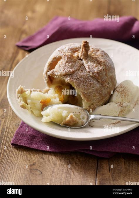 Apple dumplings and ice cream Stock Photo - Alamy