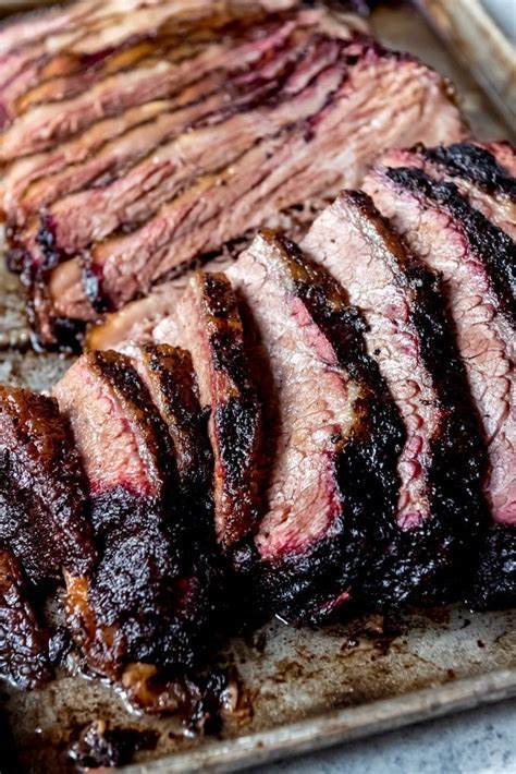 An Image Of Tender Juicy Slices Of Smoked Brisket With A Smoke Ring