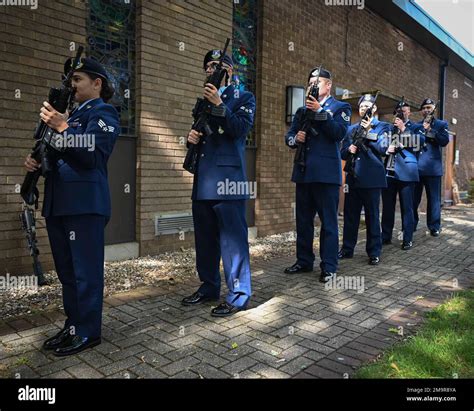 Members Of The 100th Security Forces Stand Ready During A 21 Gun Salute