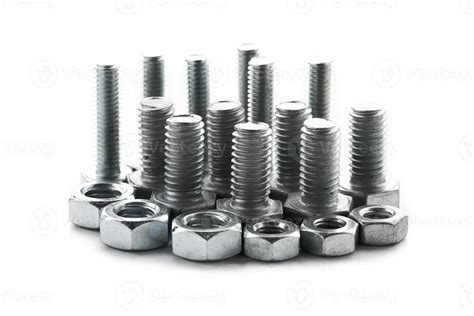 close-up steel nut screw isolated on white background. group of steel metal nut and screw ...