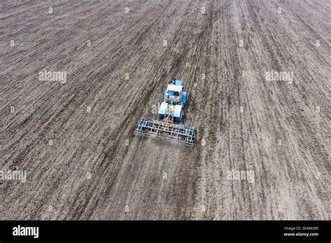 Cultivation Of Soil For The Sowing Of Cereals Tractor Plows The Soil