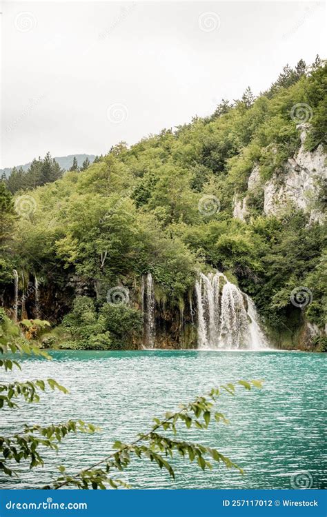 Vertical Shot Of A Scenic Waterfall With Greenery In Plitvice Lakes National Park Croatia Stock