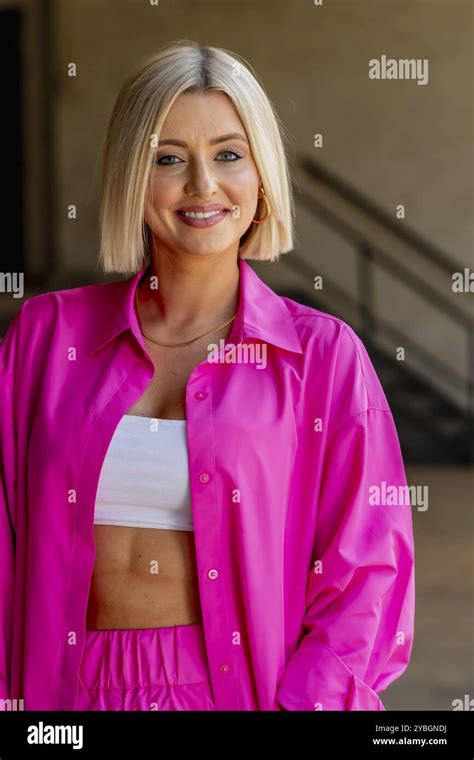 A Gorgeous Blonde Model Poses Outdoors While Enjoying The Summer Weather Stock Photo Alamy