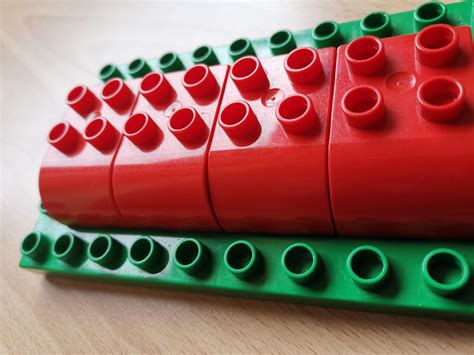 Lego Duplo: why does this piece have 2 different versions with slightly