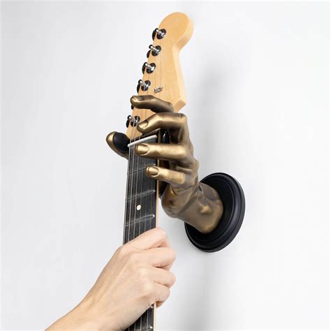 Musicians found a guitar hanger that protects fragile finishes 29