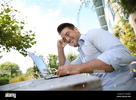 Mature Man On Week End Working From Home With Laptop Stock Photo Alamy