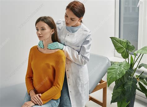 Thyroid examination - Stock Image - F036/2687 - Science Photo Library