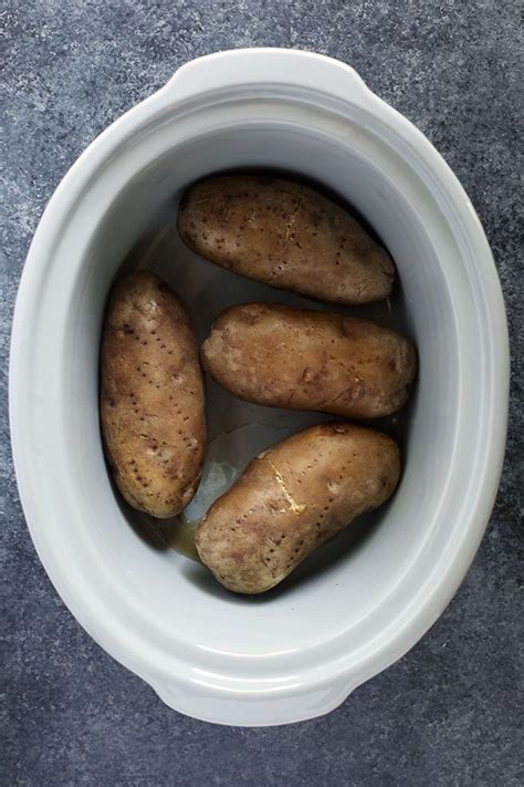 The Easiest Way To Make Perfect Baked Potatoes Is In The Crock Pot