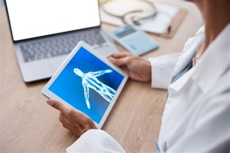 Premium Photo Doctor Hands And Tablet With Laptop Mockup Screen For