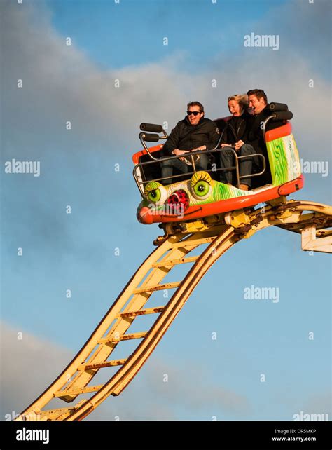 Three people on the Crazy Mouse roller coaster ride on Brighton Pier ...